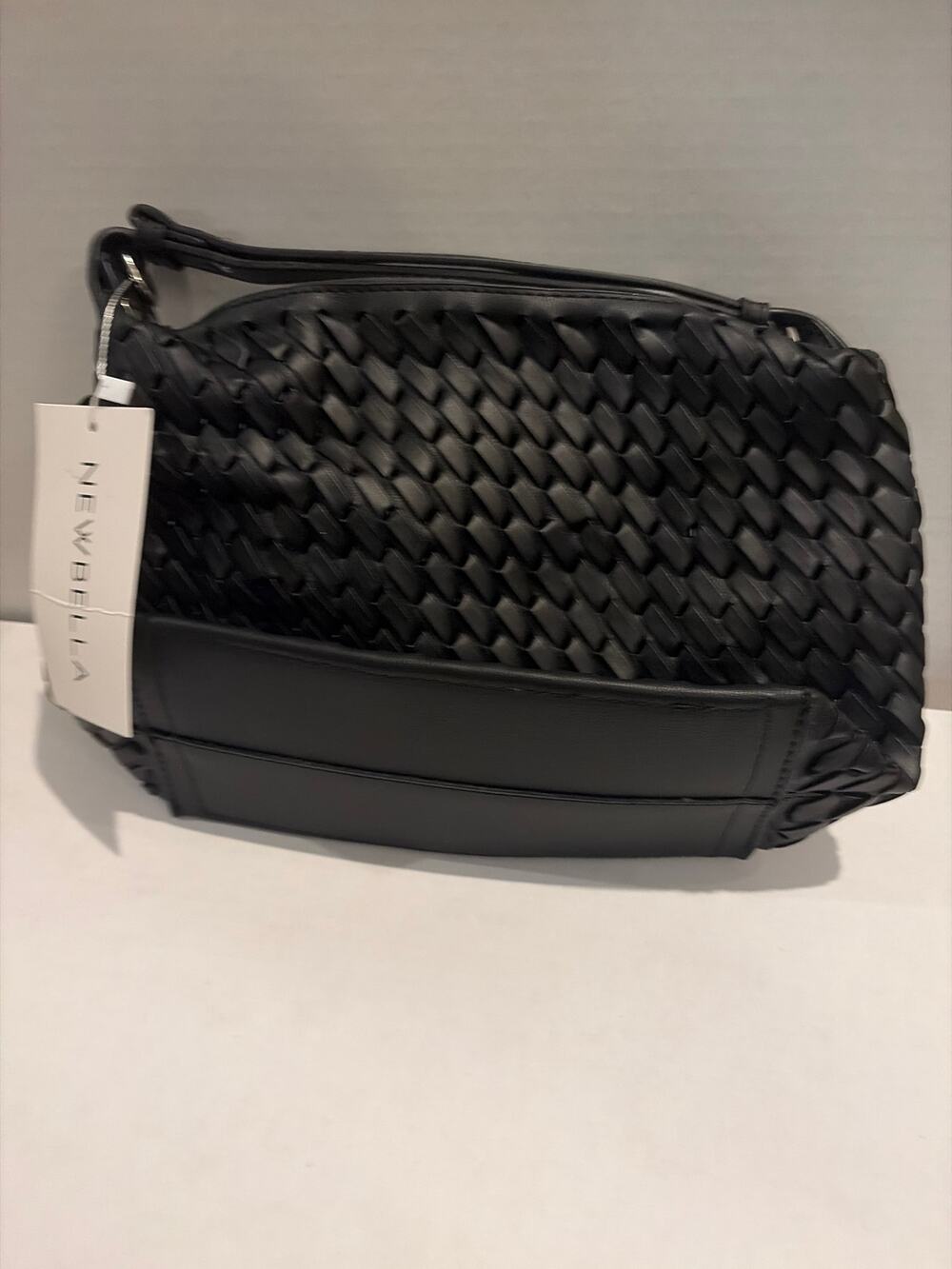 black woven shoulder bag from the brand NEWBELLA